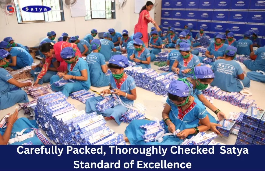 Satya Incense workers in uniform hand-packing incense sticks with precision and care in a clean facility, reflecting quality control and commitment to excellence